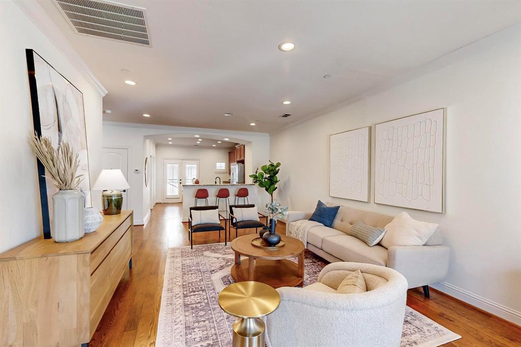 a living room with furniture and a table