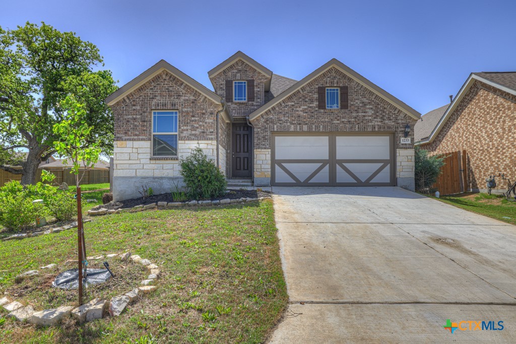 a front view of a house with garden