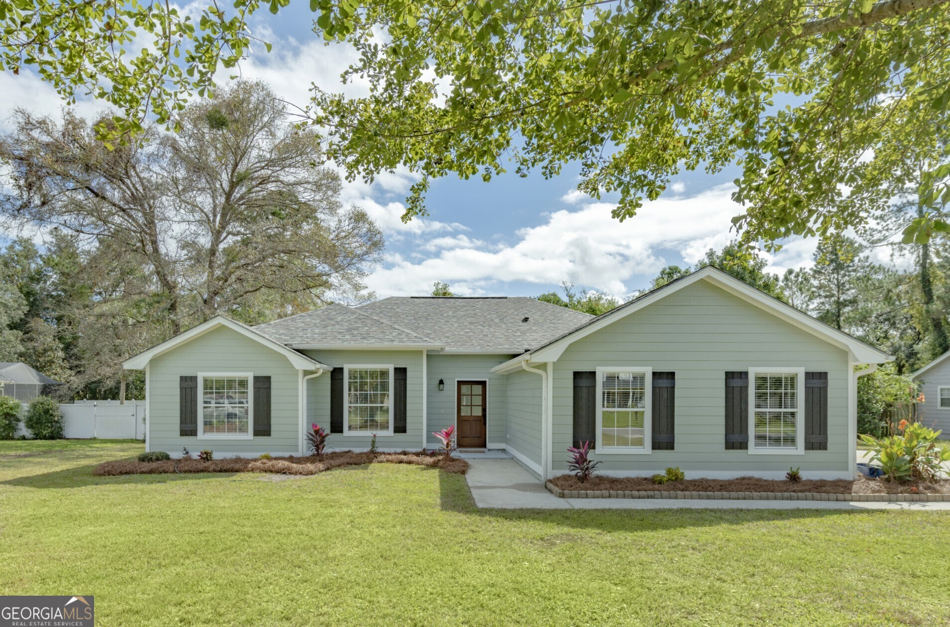 a front view of house with yard and seating area