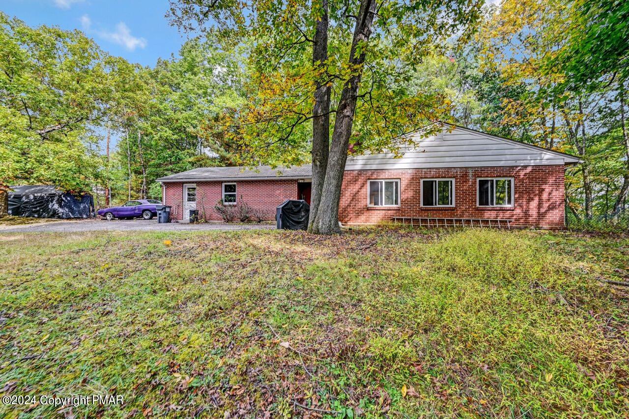 front view of a house with a yard