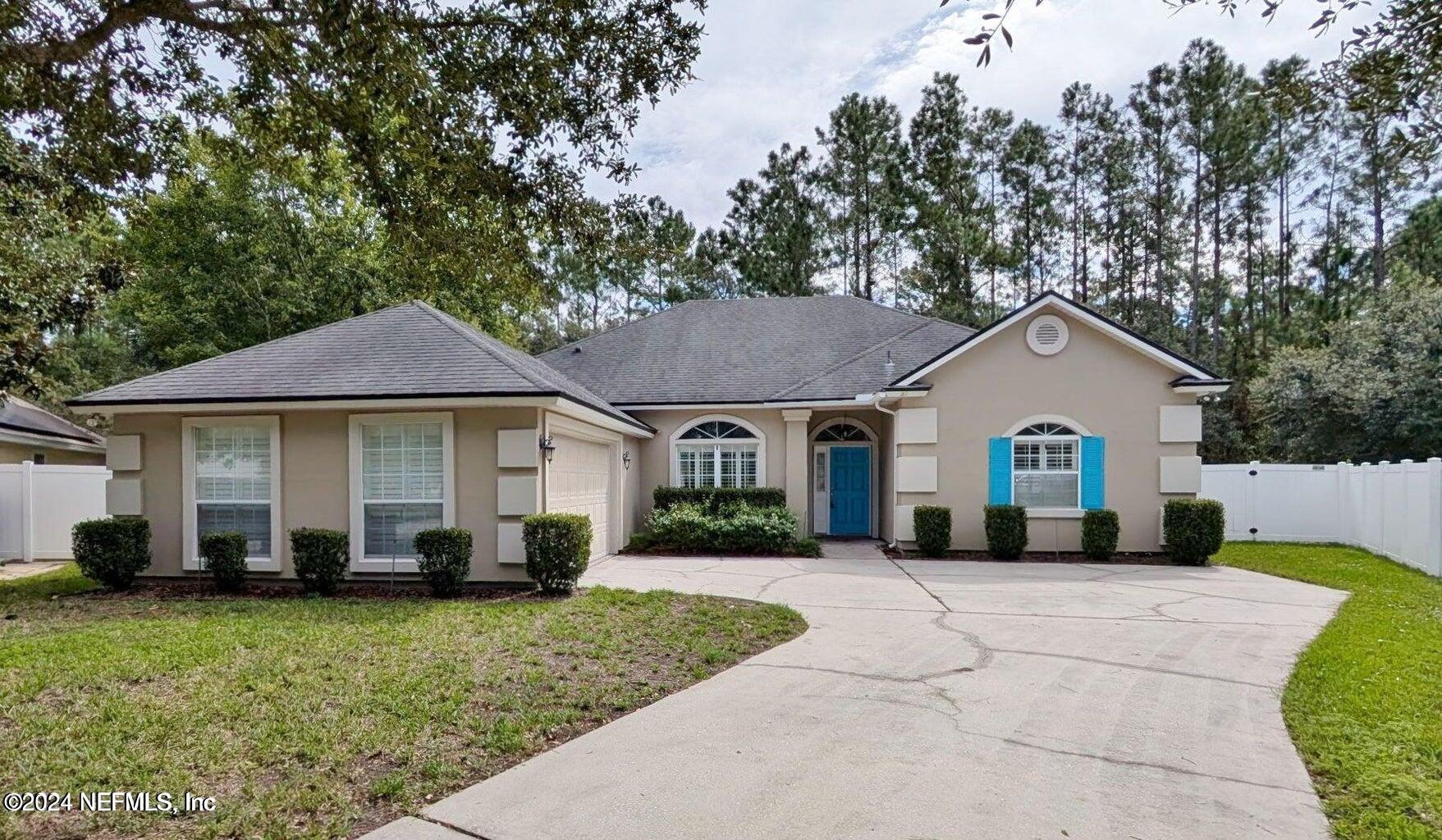 a front view of a house with a yard and porch