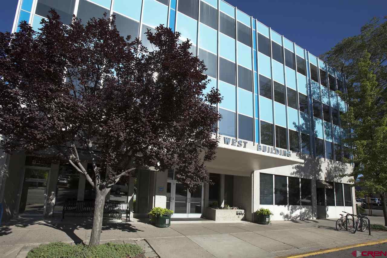 a view of a building with a tree