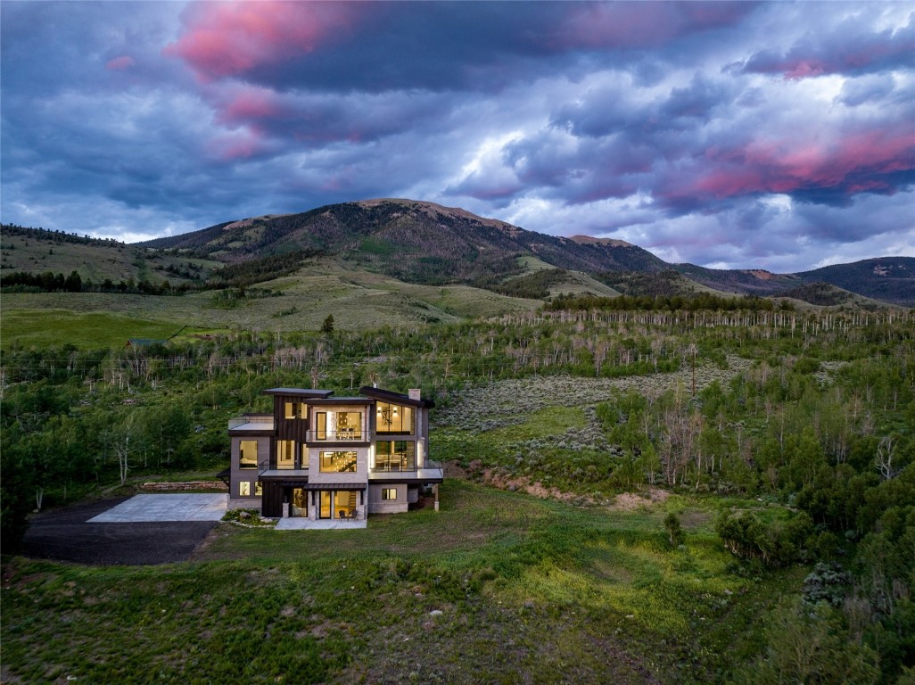 View of home on the property sitting among the  mountains.