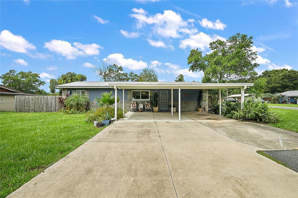 front view of a house with a yard