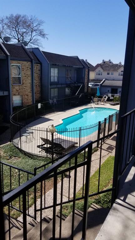 a view of a house with backyard and deck