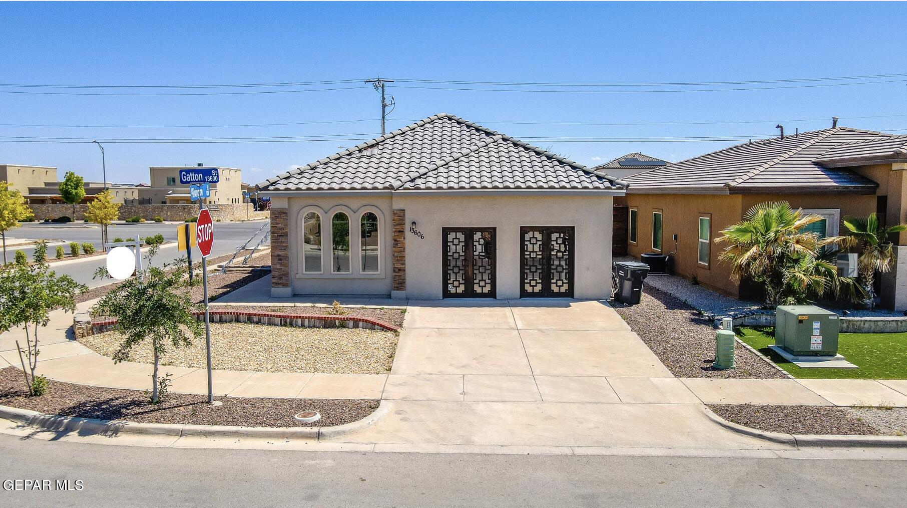 a front view of a house with garden