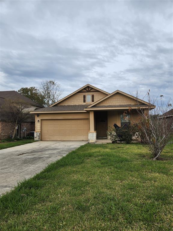 a view of a house with yard and sitting area