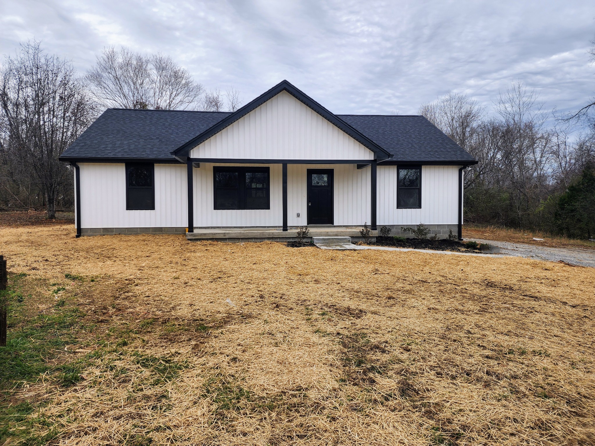 a front view of a house with yard