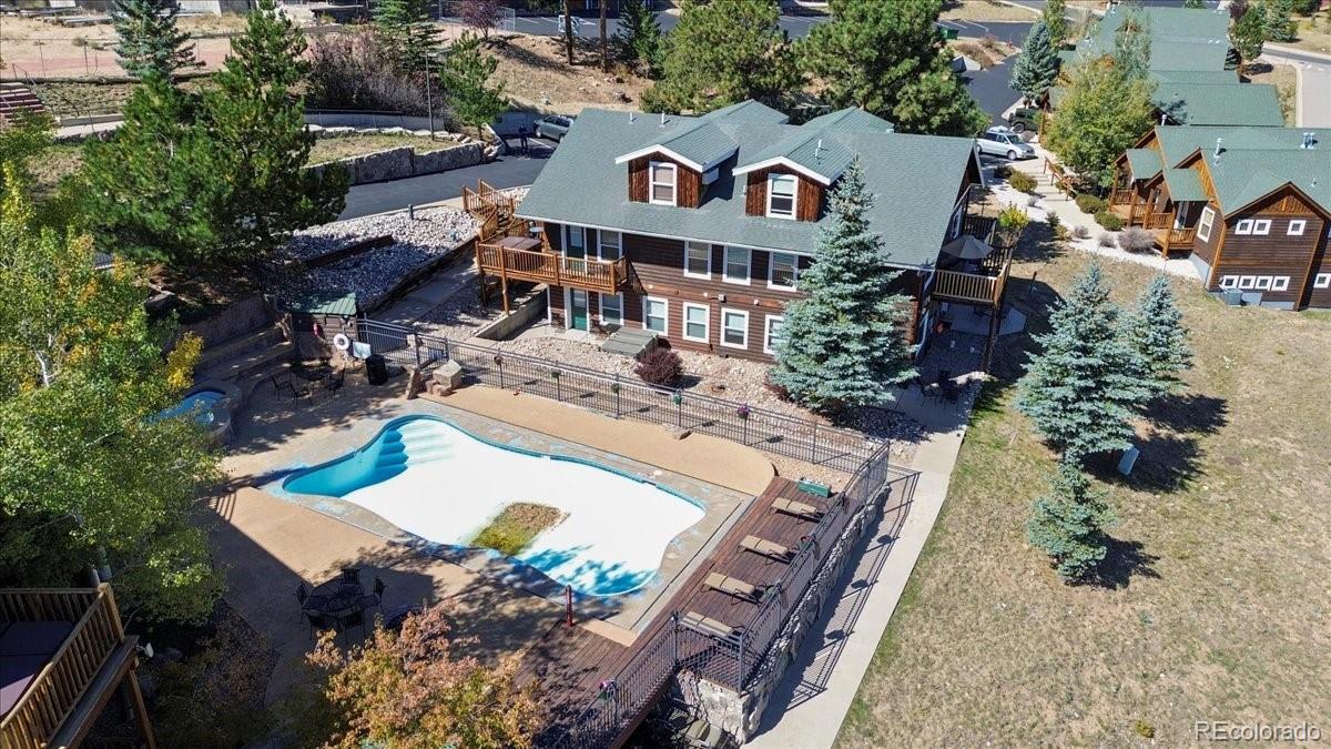 an aerial view of multiple houses with yard