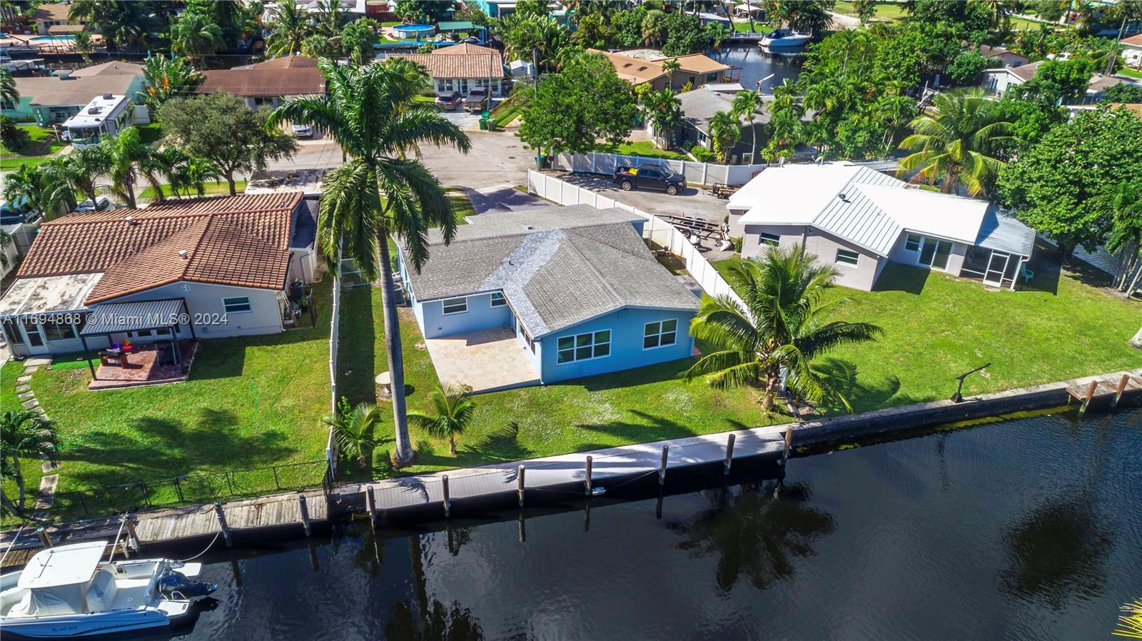 an aerial view of house with yard swimming pool and outdoor seating