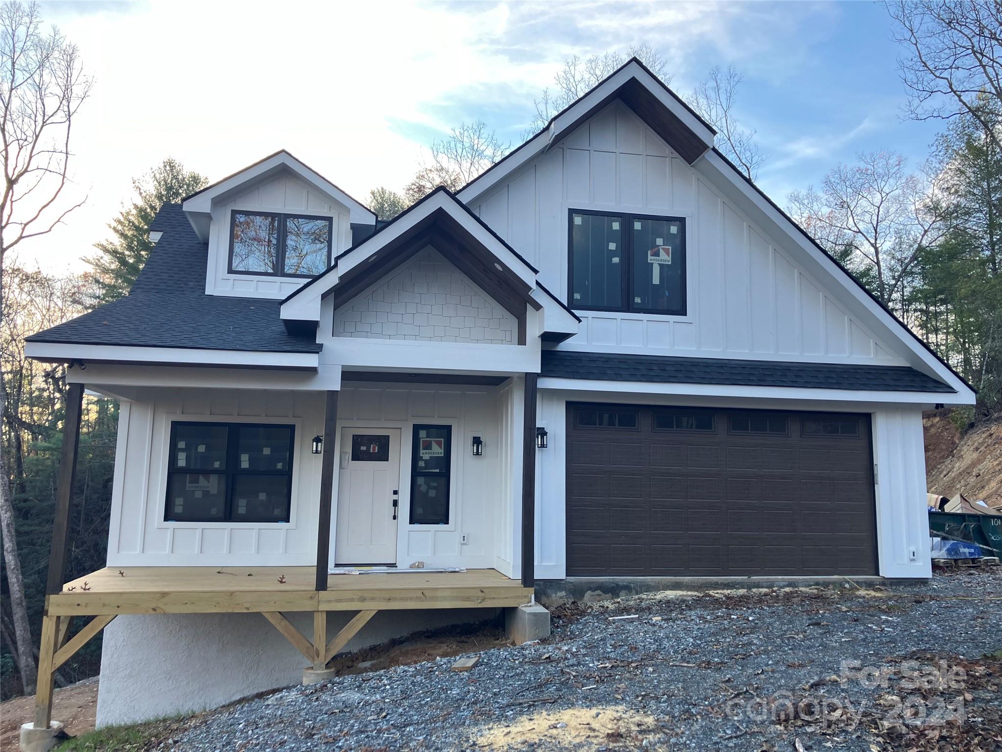 a front view of a house with a garage