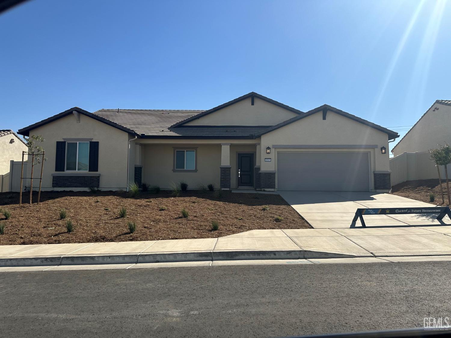 a front view of a house with garage