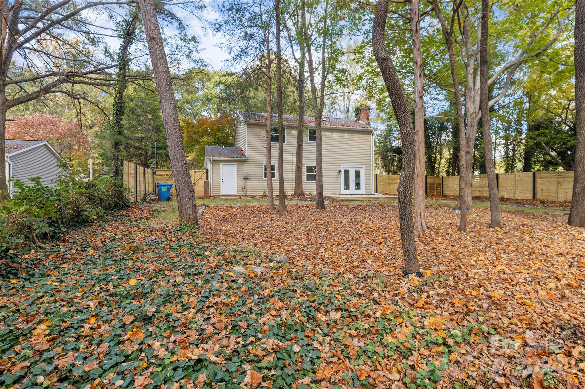 front view of a house with a tree