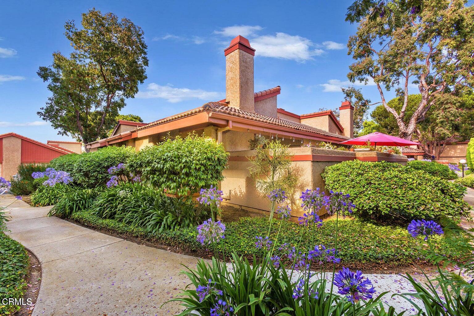 a front view of a building with garden