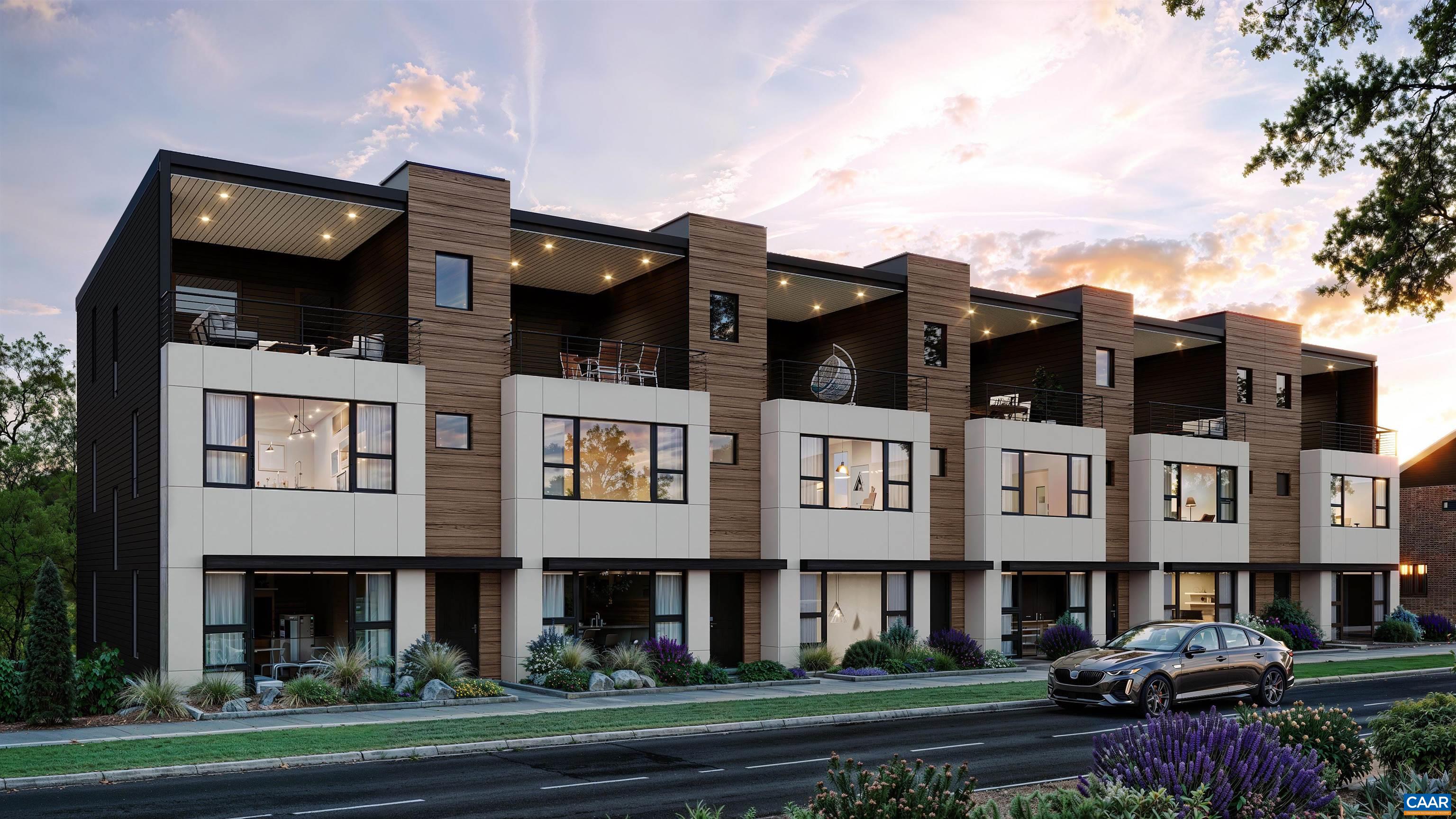 a view of a big building with many windows and a yard