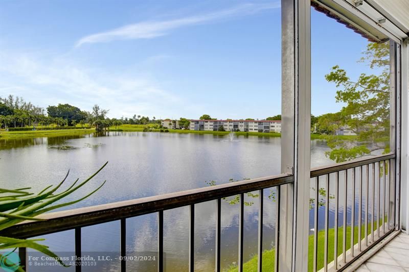 a view of a lake from a balcony