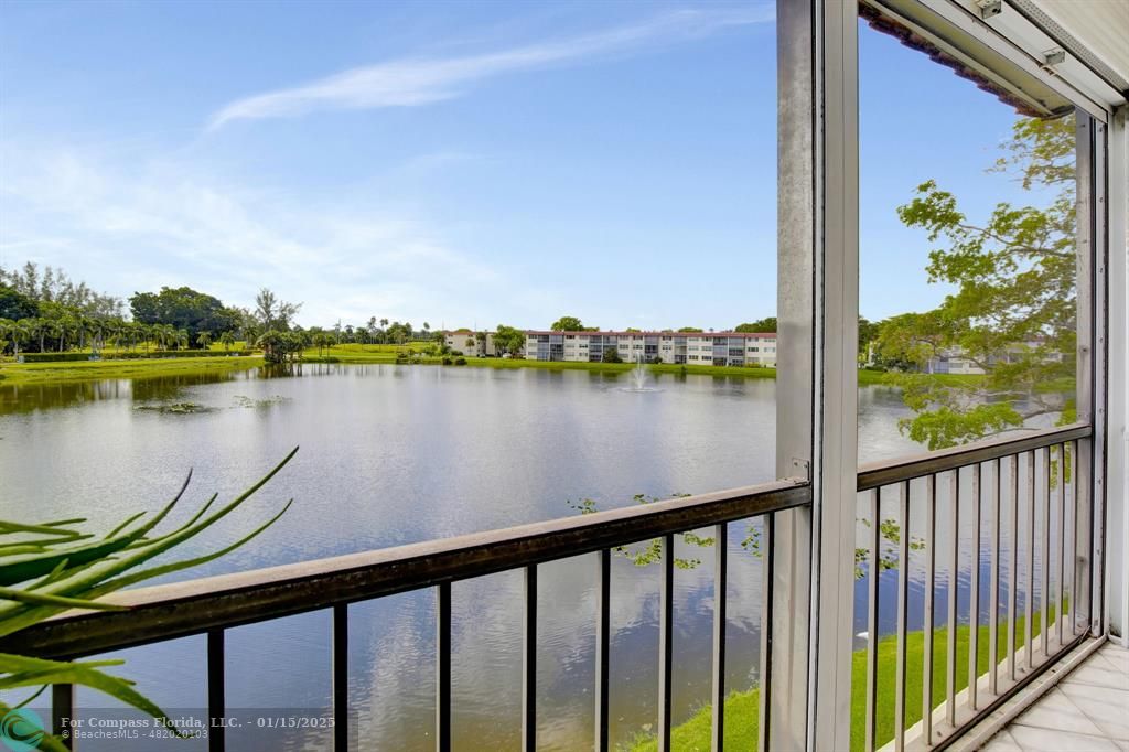 a view of a lake from a balcony