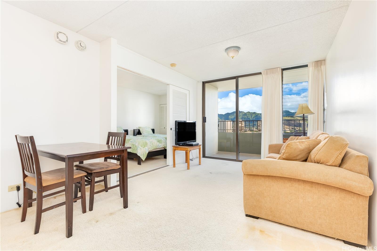 a living room with furniture and a large window