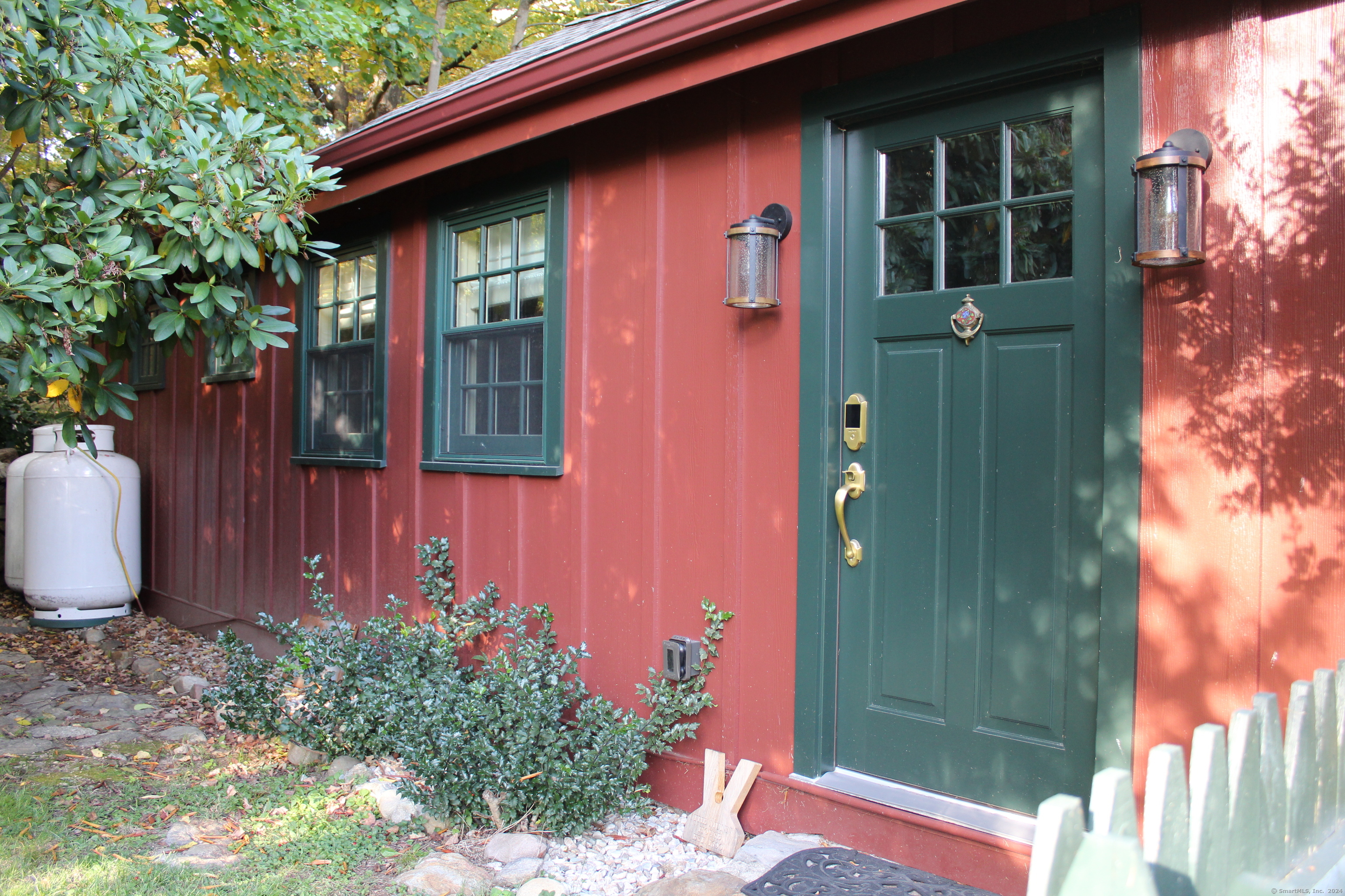 a front view of a house with garden