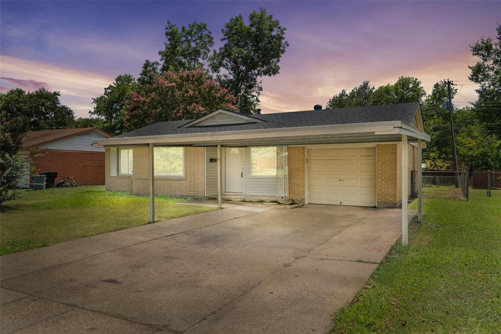 a view of large house with backyard and trees