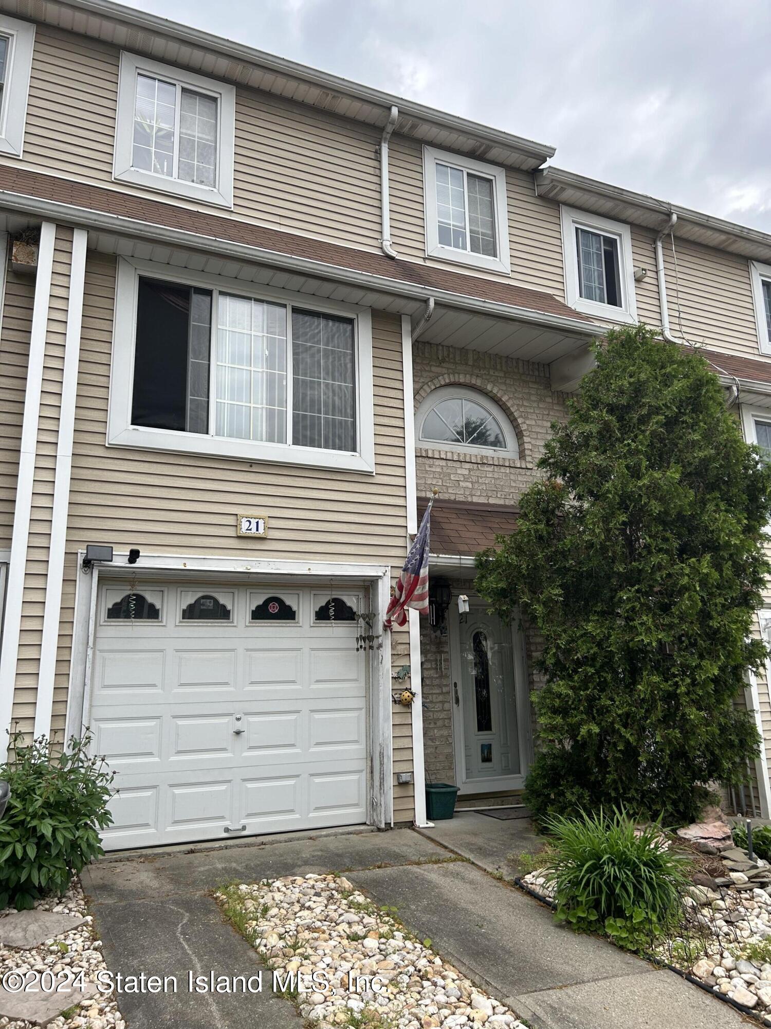 a front view of a house with a garage