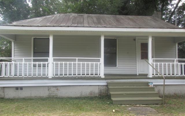 a front view of a house with a porch