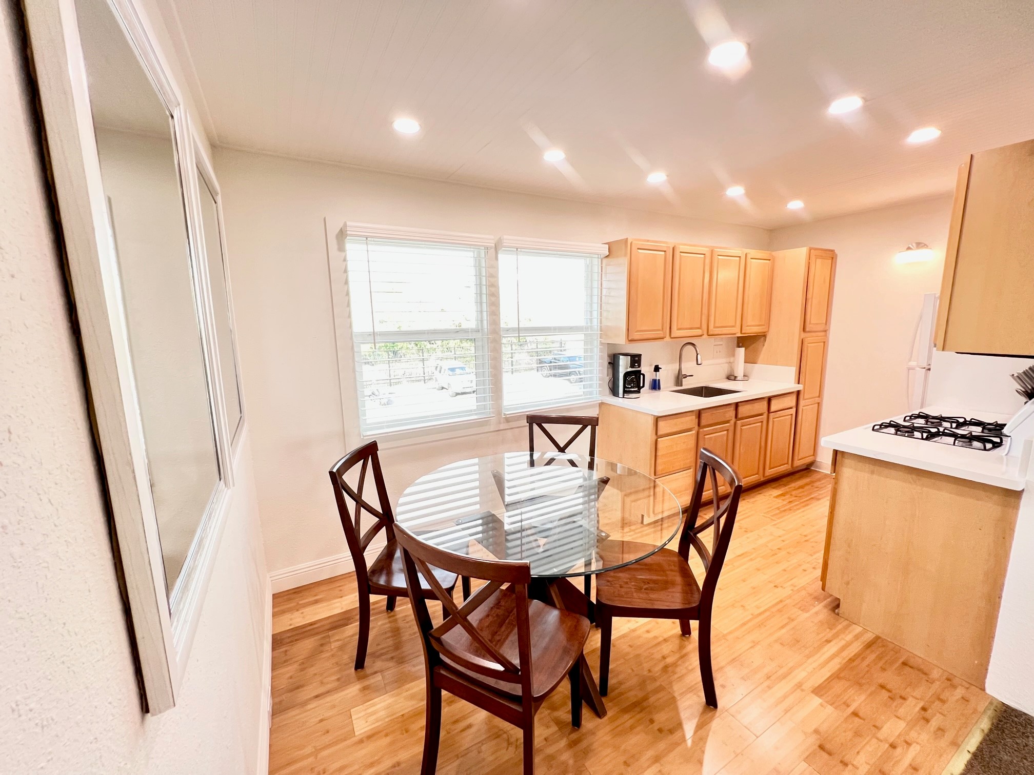 a view of a dining room with furniture and a window