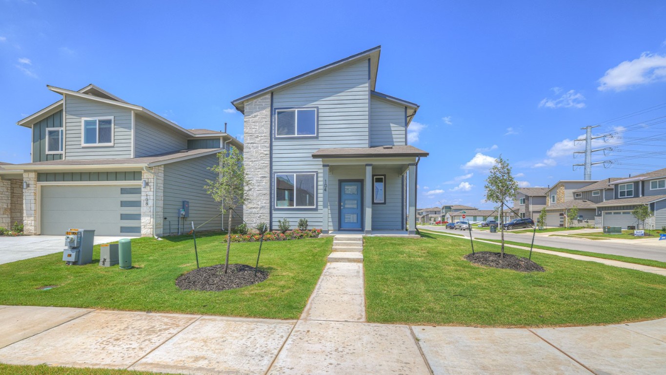 a view of a house with a yard