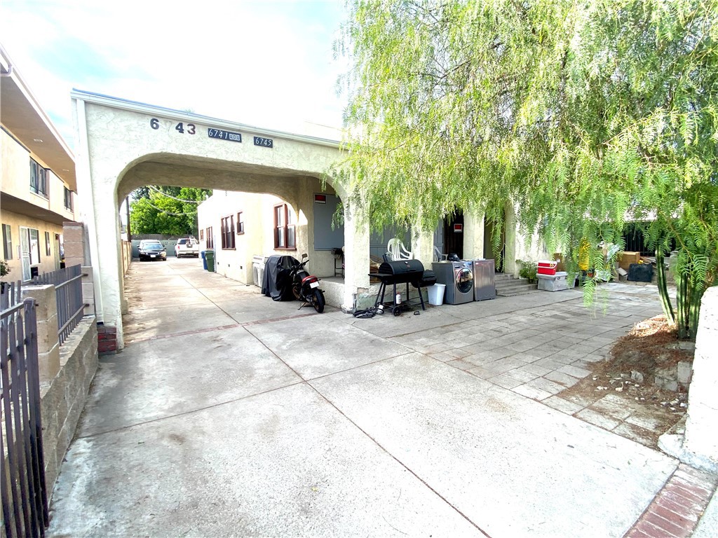 a view of a building with car parked