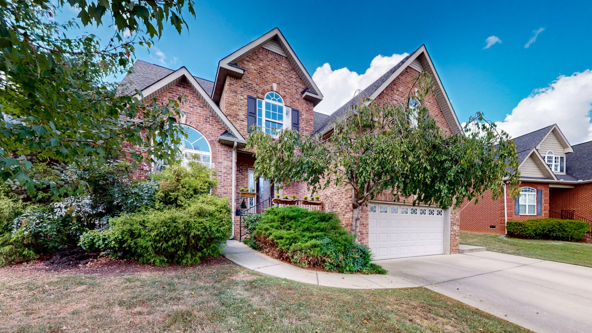 front view of a house with a yard