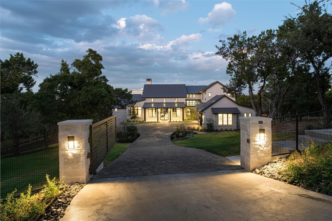 a front view of a house with garden