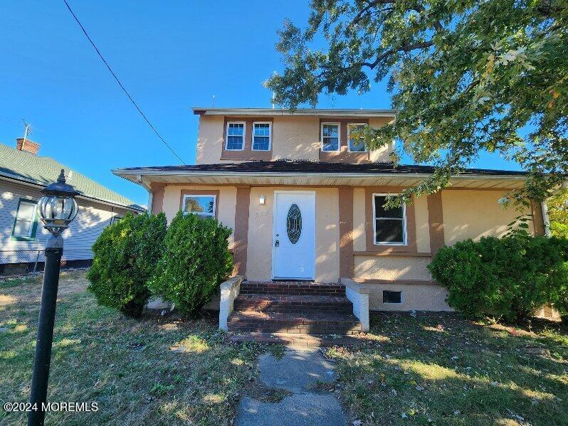 front view of a house with a yard