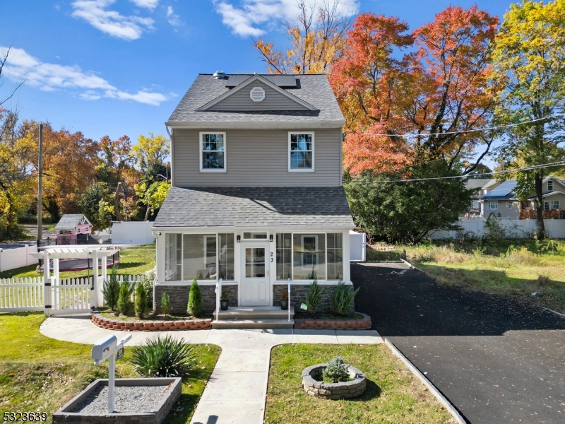 a view of a house with swimming pool and porch