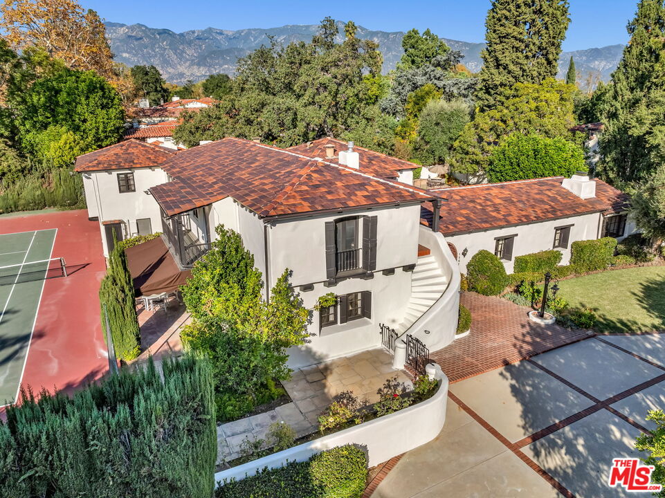 an aerial view of a house with a garden