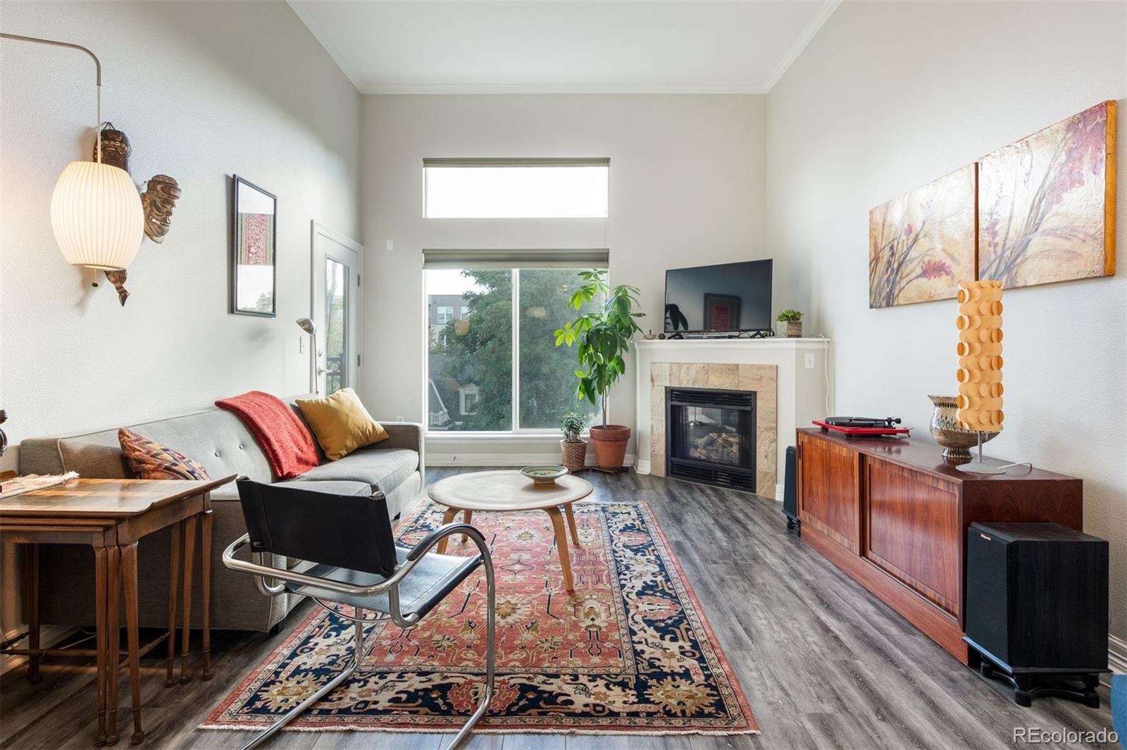 a living room with furniture fireplace and flat screen tv