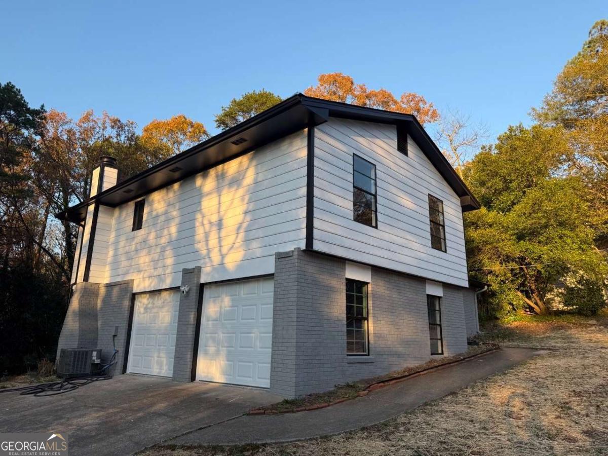 a front view of a house with a garage