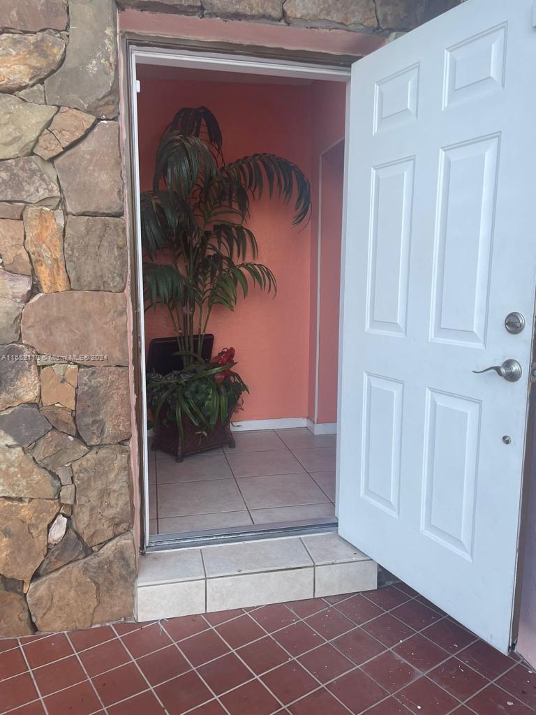 a view of a door and chair in a room