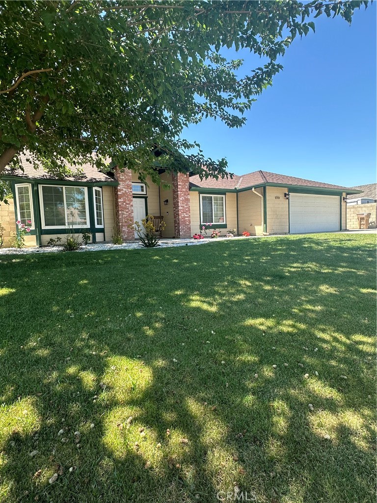 a house view with a garden space