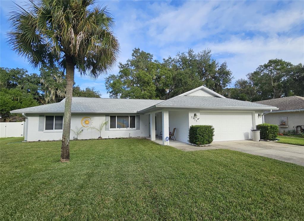 front view of a house with a yard