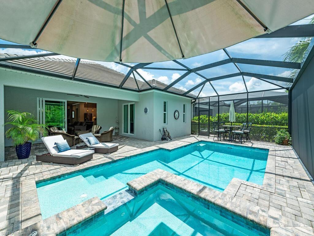 a view of swimming pool with seating area