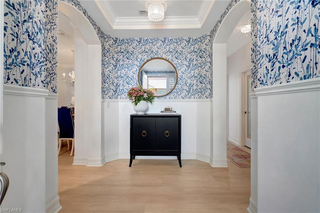 a living room with a furniture and a mirror