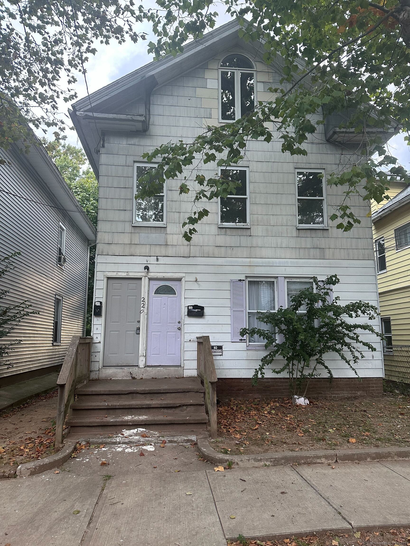 a view of a house with a street