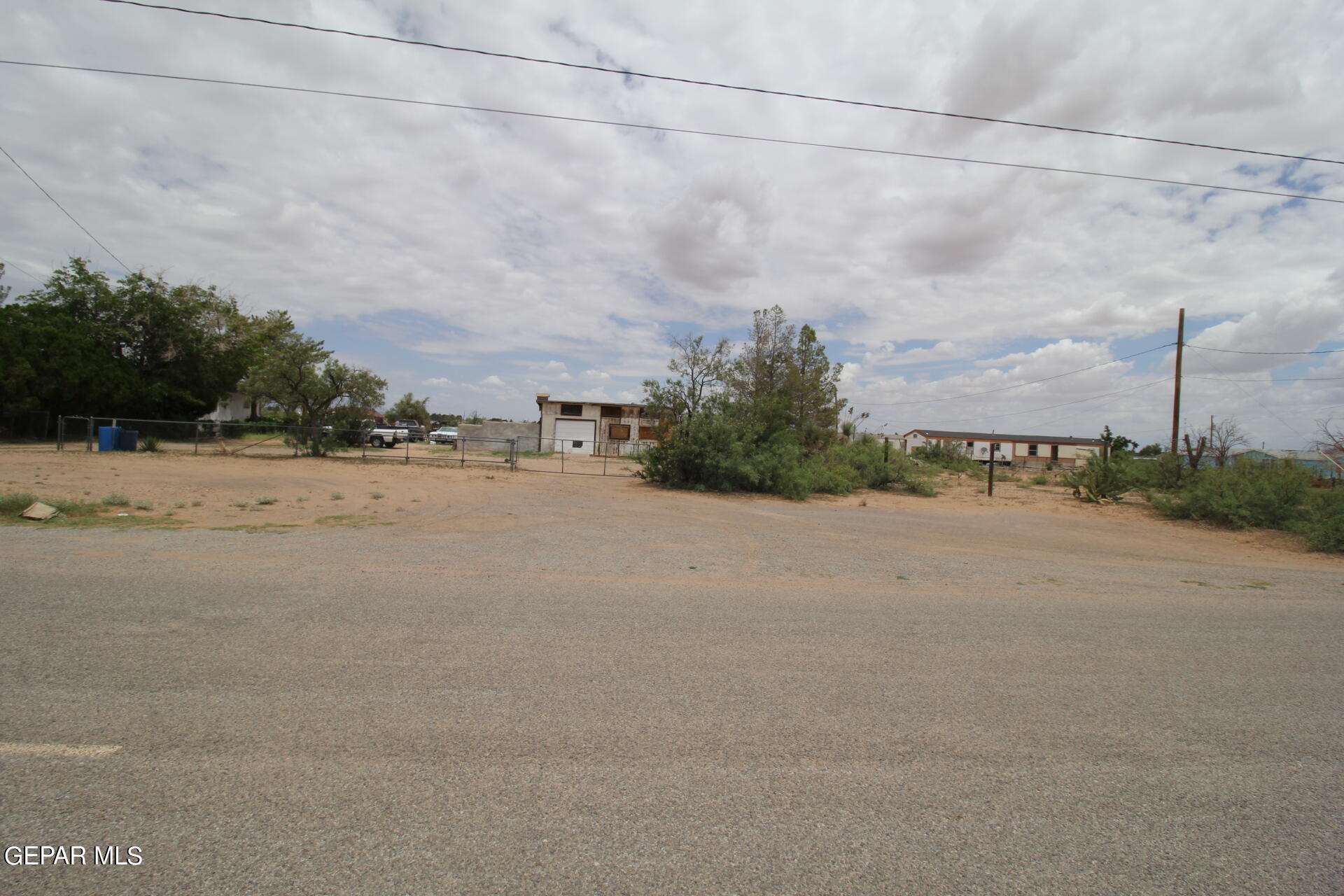 a view of a road with a building in the background