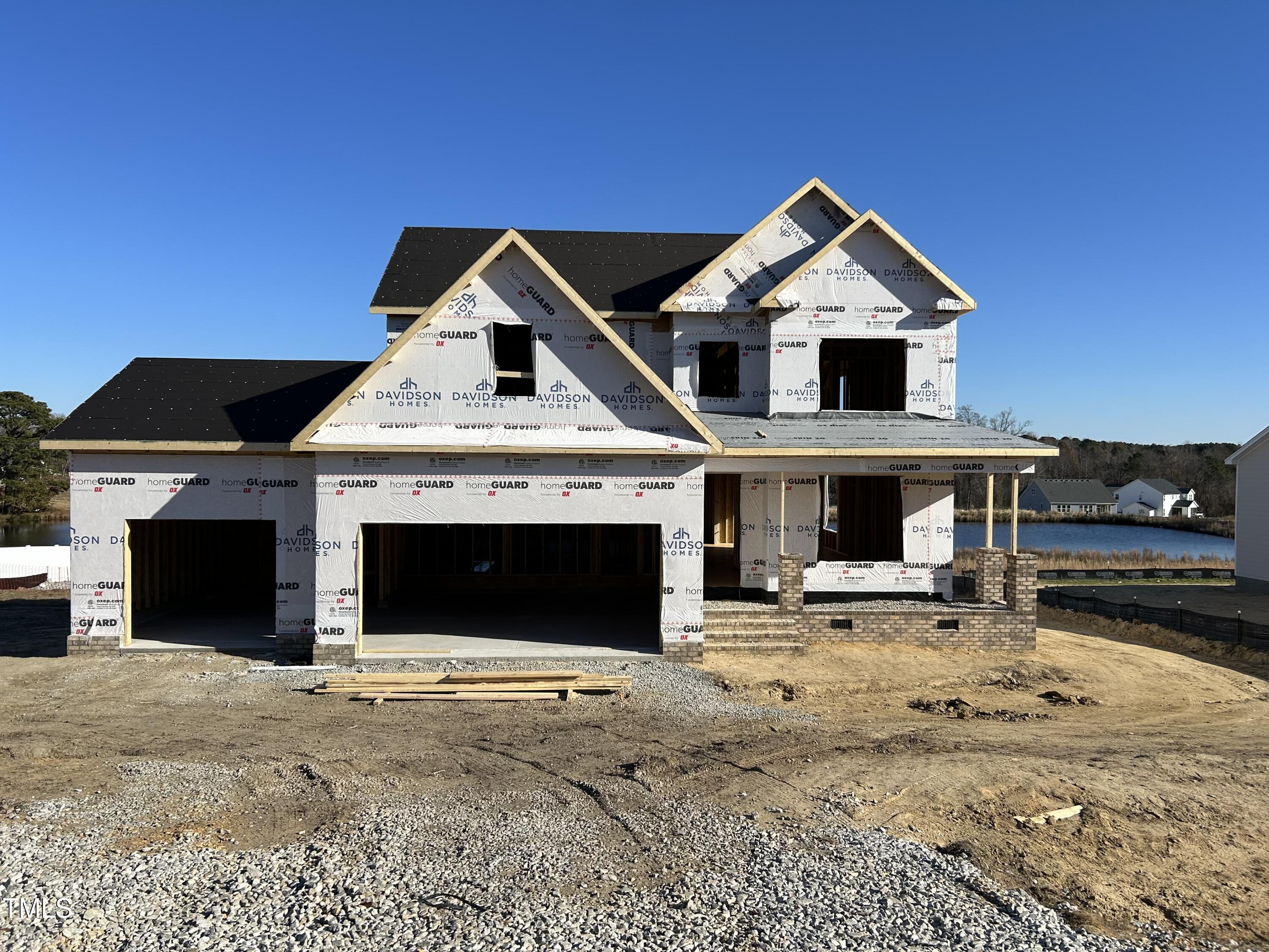 a front view of a house with parking space