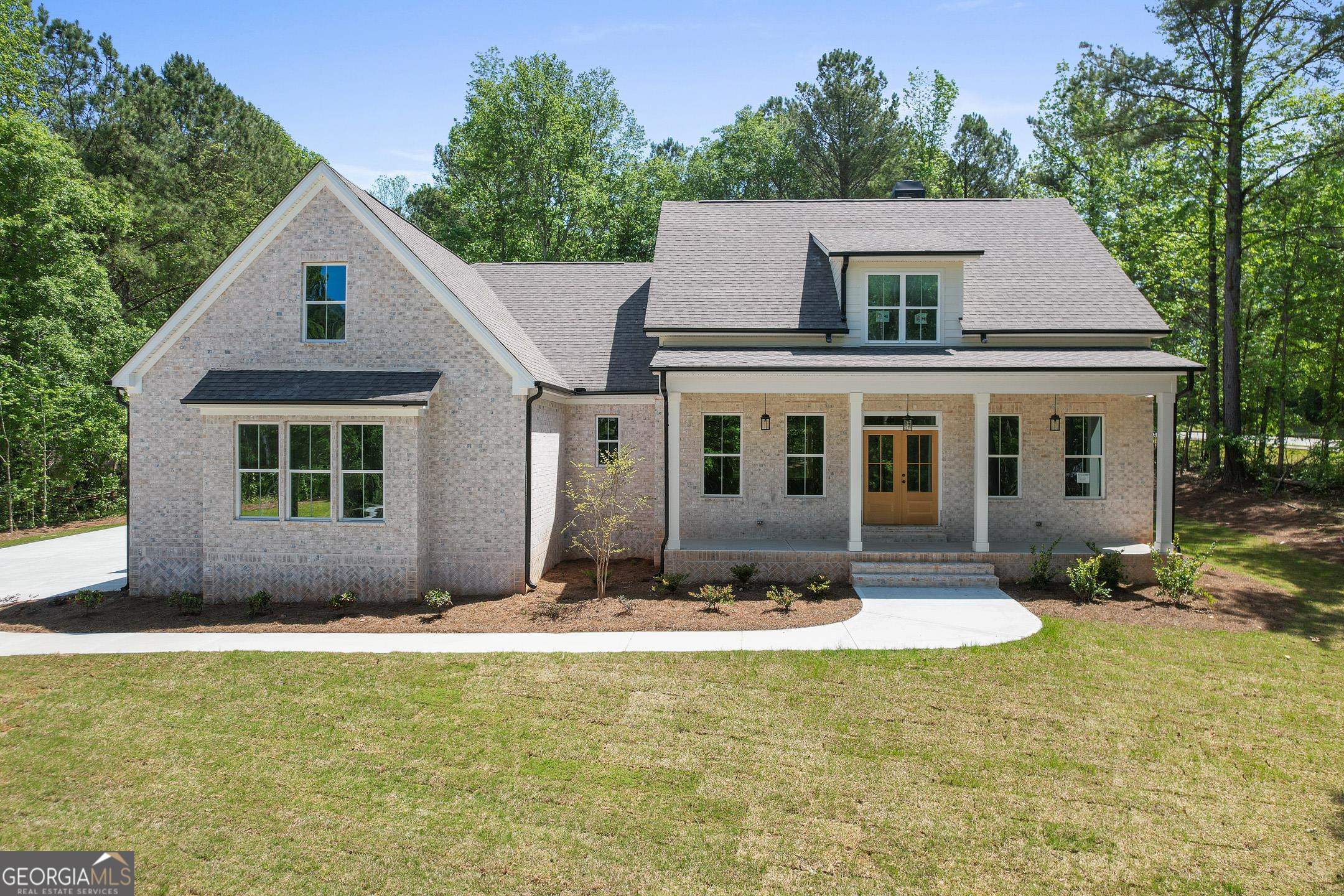 a front view of a house with a yard