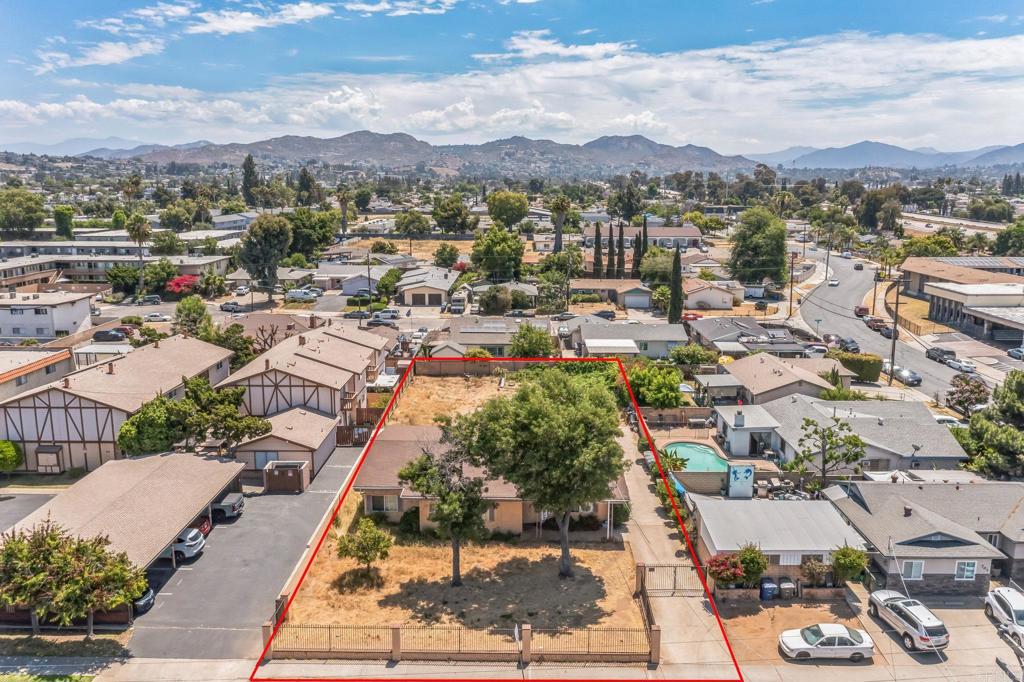 an aerial view of residential houses with outdoor space