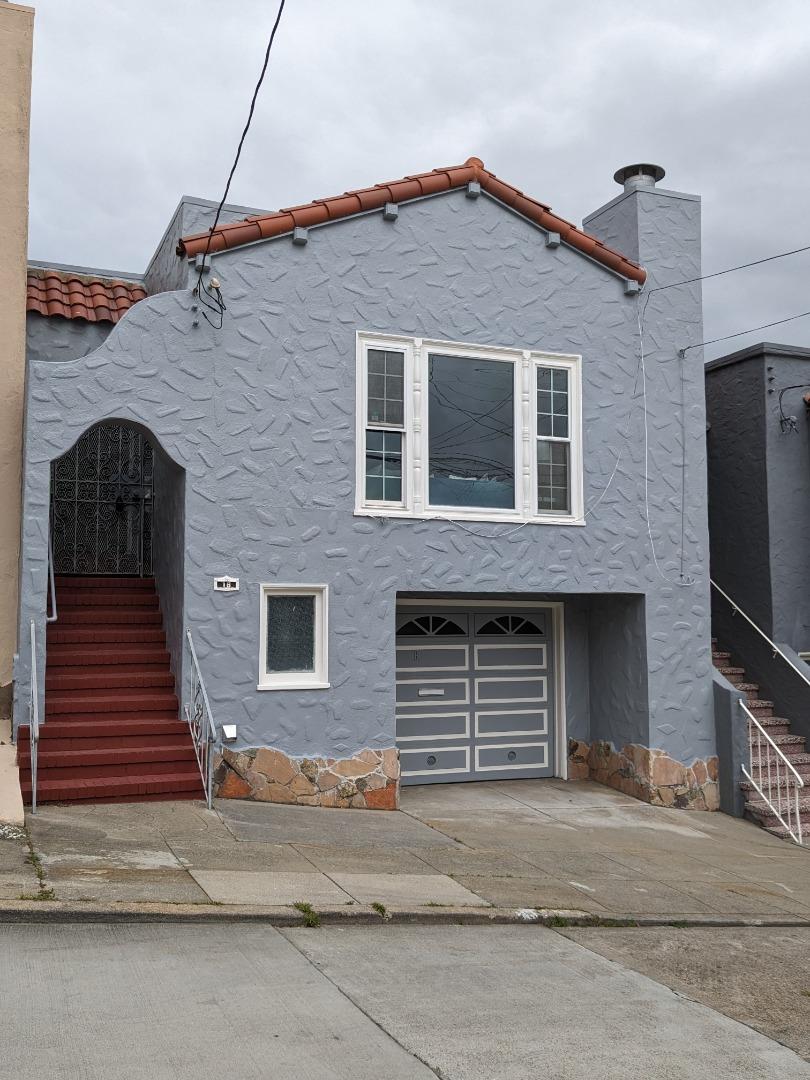 a front view of a house with a garage