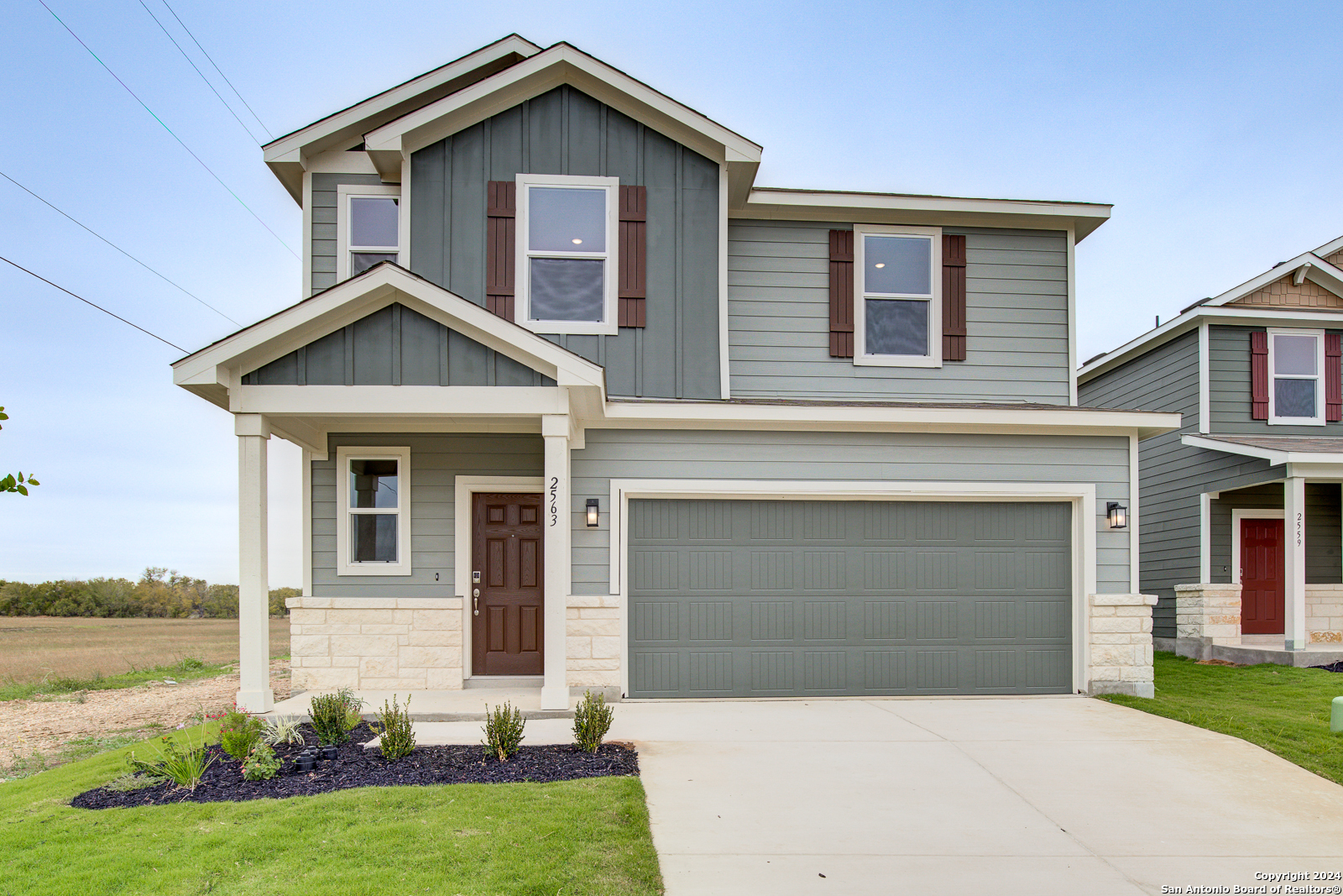 front view of a house with a yard