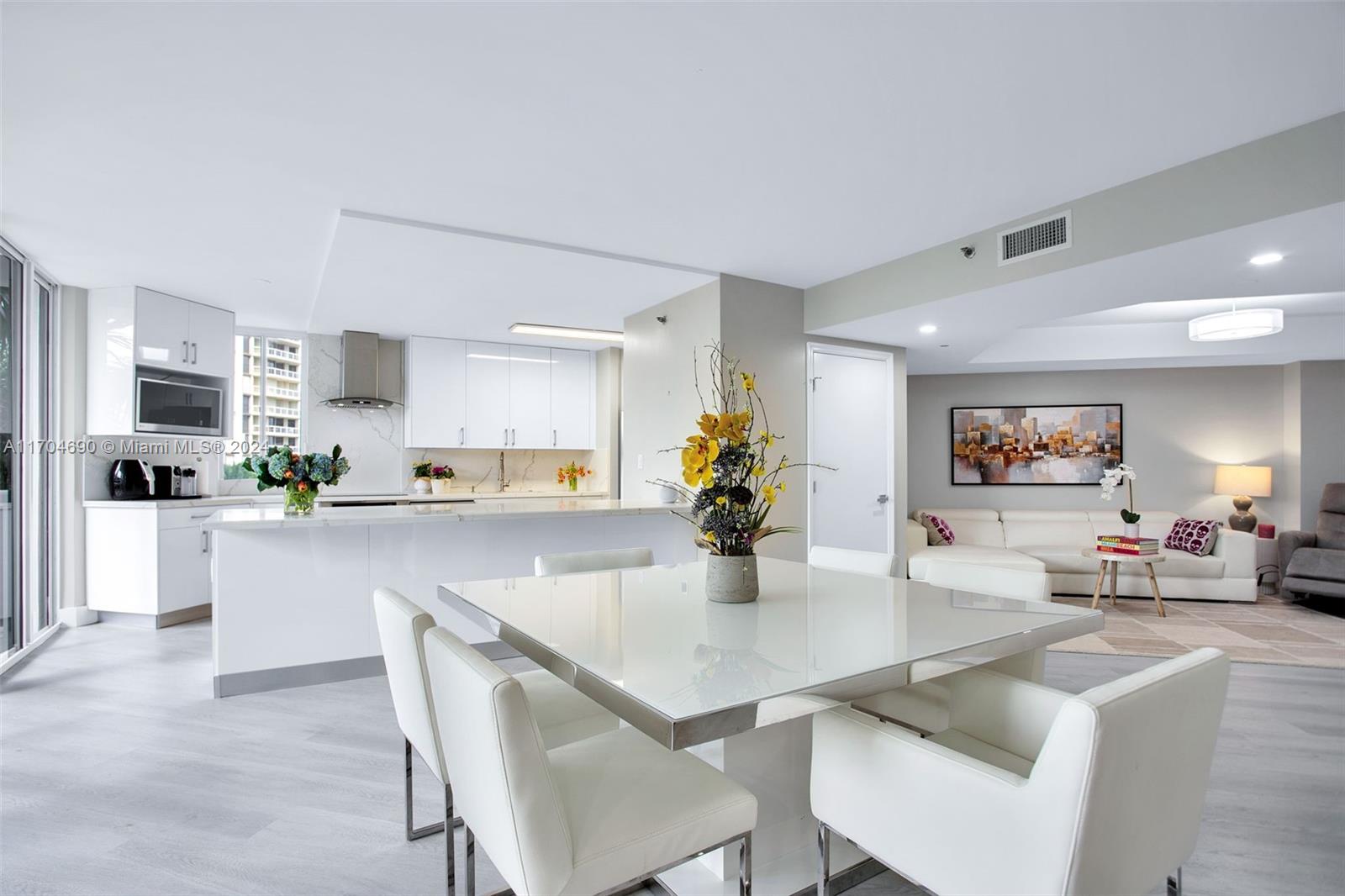 a kitchen with a table and chairs in it