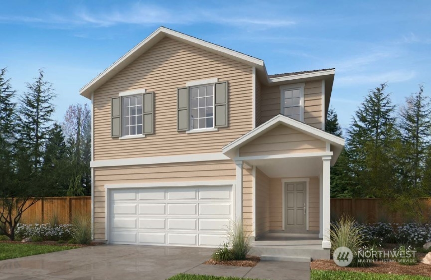 a view of a house of a yard and garage